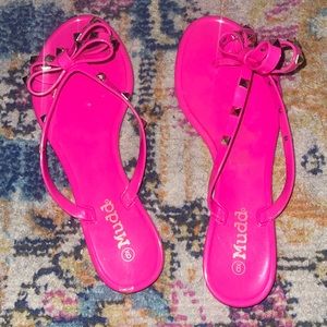 Hot pink rubber flip flops